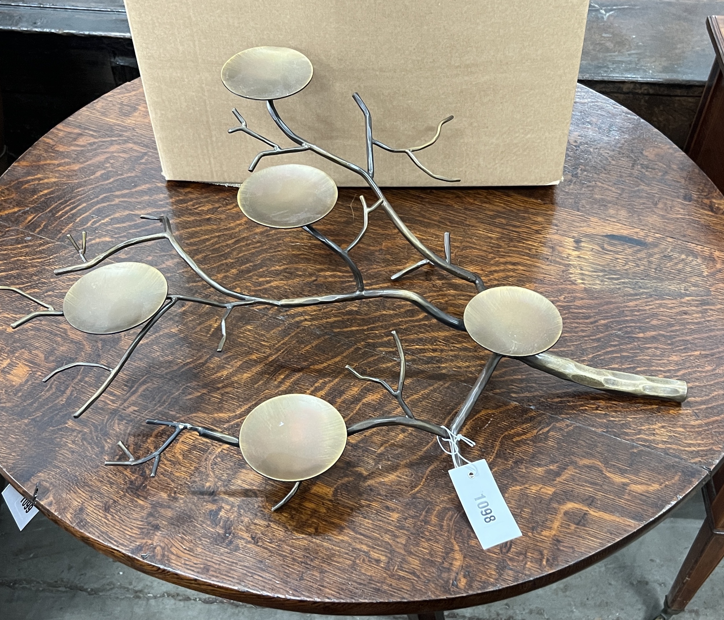 A set of four contemporary metal naturalistic five branch candle holders, length 60cm, height 20cm